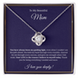 Close-up of Love Knot Necklace in gift box with heartfelt message for Mom