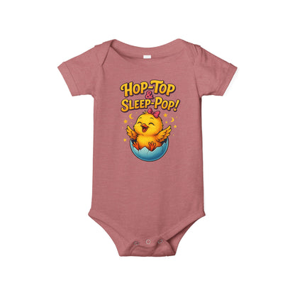 Pink baby onesie with a chick design and text 