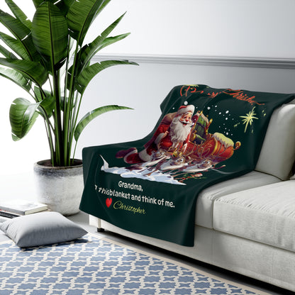 Blanket with Santa Claus design on a couch next to a plant