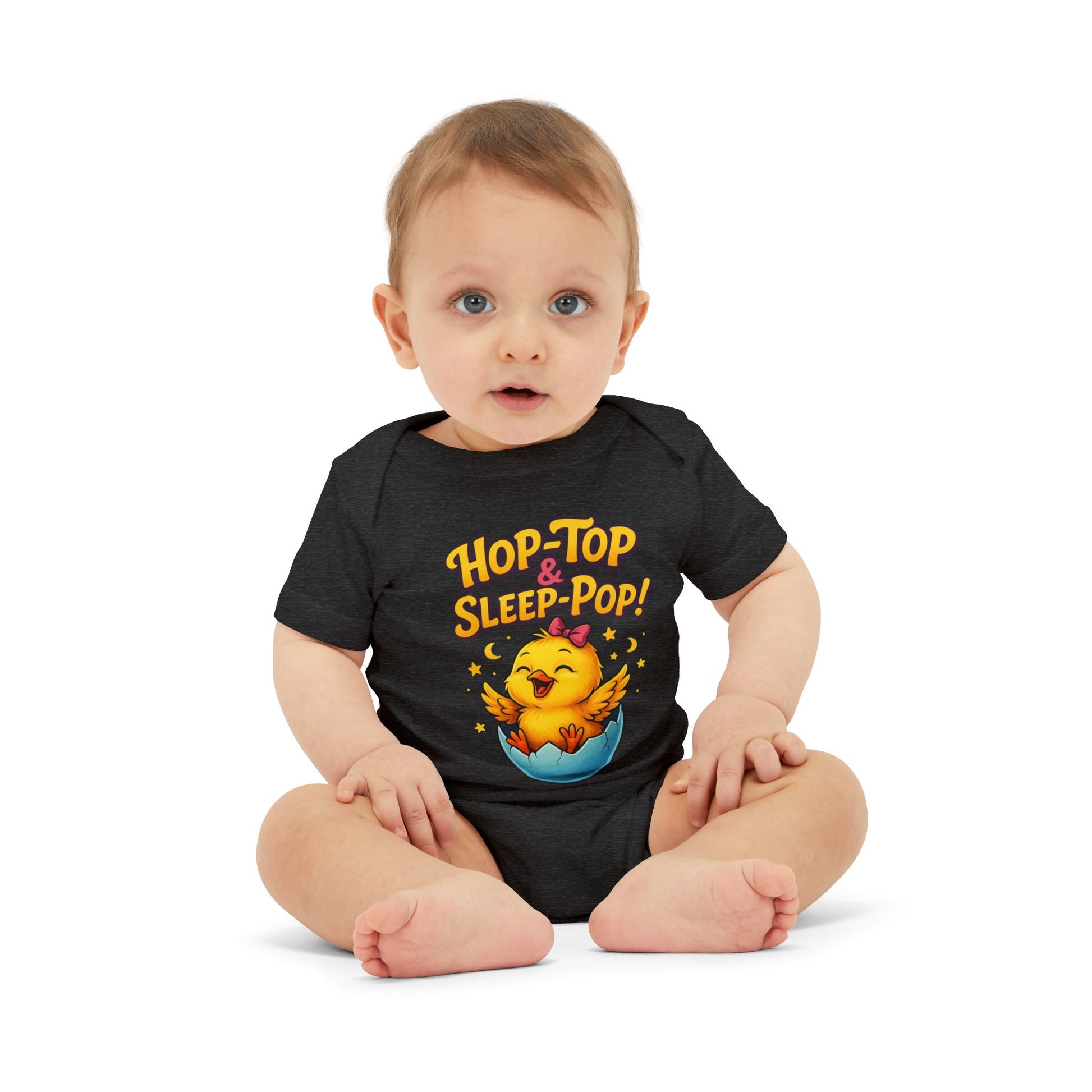 Baby wearing a black onesie with a funny cartoon chicken design .