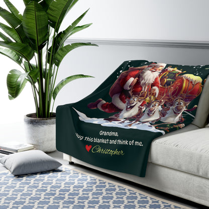 Blanket with Santa Claus and reindeer design on a couch, featuring text.