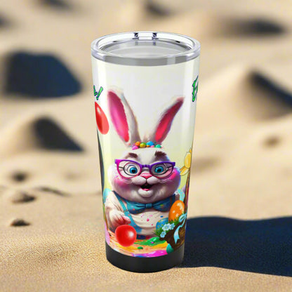 Tumbler featuring a bunny painting colorful Easter eggs. 