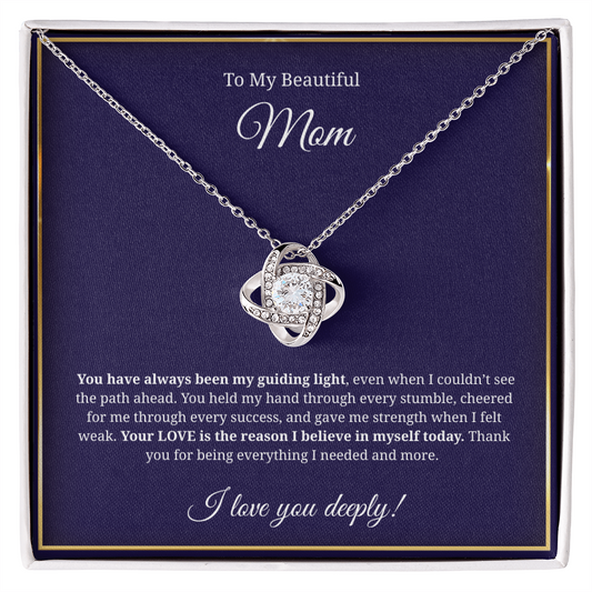 Close-up of Love Knot Necklace in gift box with heartfelt message for Mom